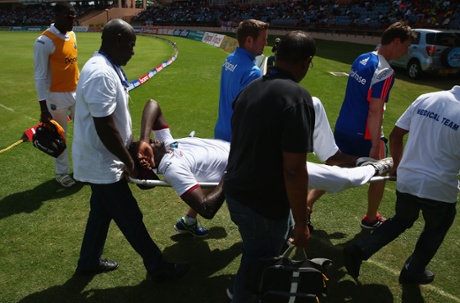 He still looks in distress as he is stretchered off.