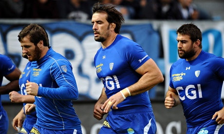 Clermont's 33-year-old lock Julien Pierre, centre, warms up before a French Top 14 rugby union match