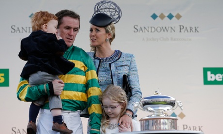 Tony McCoy with his wife Chanelle and children Eve and Archie as he waits to be presented with the Champion Jockey’s Trophy at Sandown.