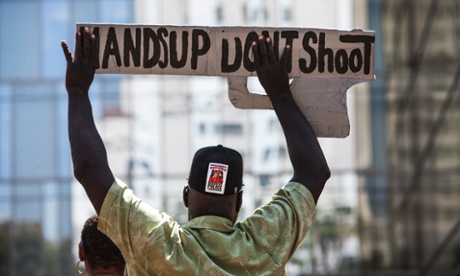 Protesters rally in front of the LAPD headquarters.