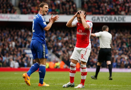 Santi Cazorla looks dejected after a missed chance as Ivanovic looks on.