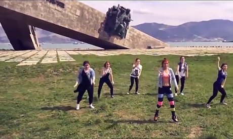 An image from the video, with the seaside memorial in the background, for which the women have been detained for ‘petty hooliganism’.