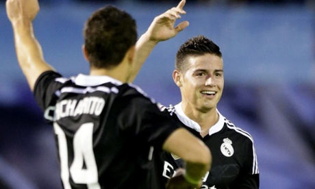 Colombian midfielder James Rodriguez celebrates with Javier Hernandez after giving Madrid the lead.