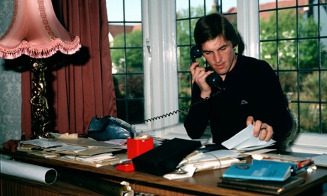 Football, Circa 1980, At home with Liverpool FC player Kenny Dalglish who is trying to keep track of his business affairs by doing paperwork and making phonecalls (Photo by Bob Thomas/Getty Images)BusyTelephoneFamous memorylane