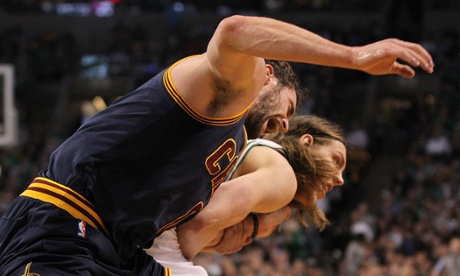 The Cleveland Cavaliers' Kevin Love could be out for the remainder of the NBA playoffs after the Boston Celtics' Kelly Olynyk injured his shoulder during this play from Sunday's game 4.