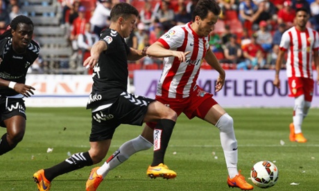 Almeria's midfielder Javier Espinosa, right, battles with Abraham Minero 