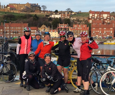 Helen Pidd (standing, third from left) and fellow members of the Team Glow cycling club in Whitby harbour