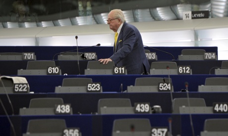 Former National Front leader Jean-Marie Le Pen looks for his seat at the European parliament in Strasbourg.