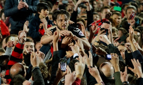 Bournemouth's Harry Arter celebrates with fans at the final whistle.