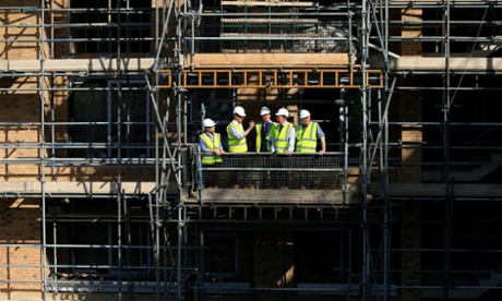 Prime Minister David Cameron (second left) visits the Weston Homes Aura building site, Edgware, London.