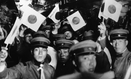 Japanese troops leave Tokyo in a train bound for Manchuria, occupied by Japan from 1931 to 1945