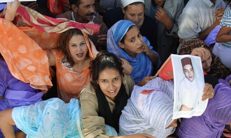 Morocco women cheer King Mohammed VI, who has led progressive policies. 