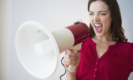 Woman yelling into megaphone
