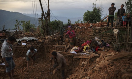Villagers in Paslang, Gorkha try to salvage their belongings from the debris of their house.