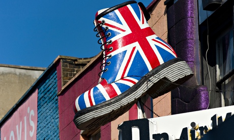Giant Dr Marten's boot with union jack over shop
