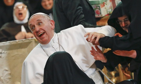 Pope Francis reacts as he is greeted by cloistered nuns at the Duomo during his pastoral visit in Naples