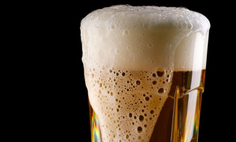 Overflowing glass of beer