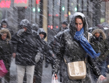 Pedestrians make their way through snow in New York on Jan. 26, 2015. More than 35 million people along the Philadelphia-to-Boston corridor rushed to get home and settle in as a fearsome storm swirled in.