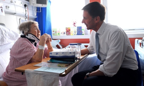 Jeremy Hunt meets a patient, Monica Kneebone, at Kings College hospital in London.