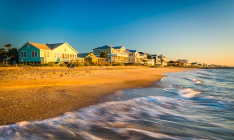 Waves in the Atlantic Ocean and morning light on beachfront homes at Edisto Beach, South Carolina