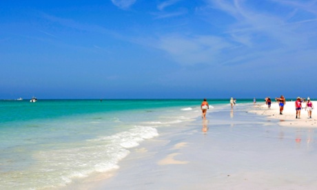 People walking along the beach at Siesta Key Florida