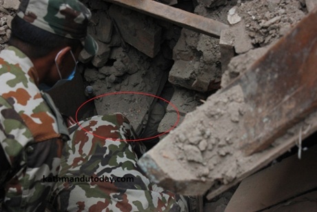 A baby boy is found under the rubble.