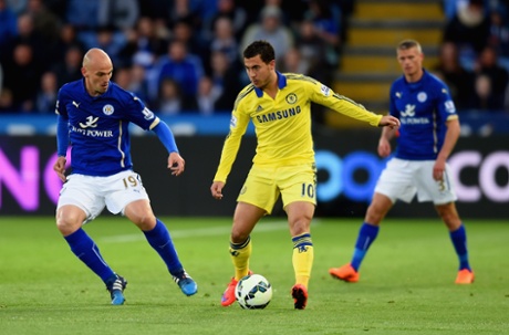 Esteban Cambiassomarshalls Eden Hazard.