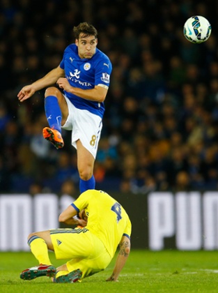 Matthew James has a shot, under pressure from Cesc Fabregas