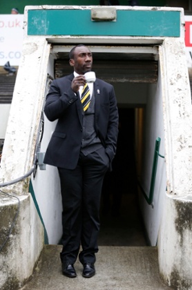 Jimmy Floyd Hasselbaink at Home Park. Enjoying what he's seeing, as well as a cuppa.
