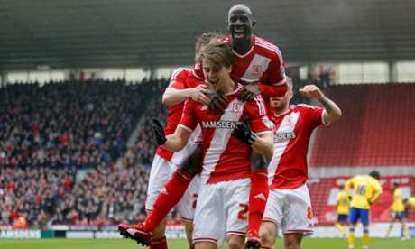 Middlesbrough's Patrick Bamford celebrates his opener with Albert Adomah during the Sky Bet Championship match at the Riverside Stadium, Middlesbrough. PRESS ASSOCIATION Photo. Picture date: Friday April 3, 2015. See PA story SOCCER Middlesbrough. Photo credit should read: Richard Sellers/PA Wire. RESTRICTIONS: Editorial use only. Maximum 45 images during a match. No video emulation or promotion as 'live'. No use in games, competitions, merchandise, betting or single club/player services. No use with unofficial audio, video, data, fixtures or club/league logos.