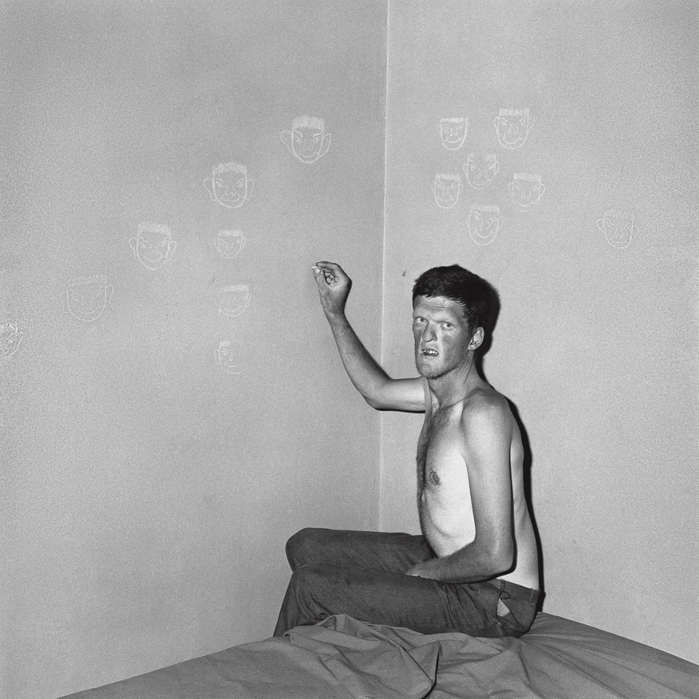 Man drawing chalk faces, 2000