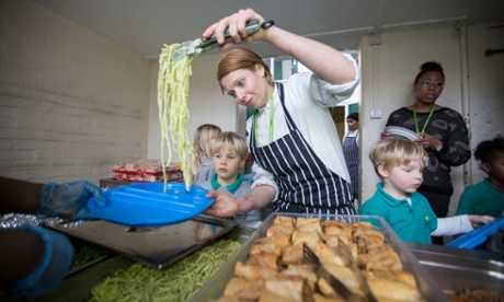 Former Ottolenghi chef Nicole Pisani serves lunch to pupils at serves at Gayhurst primary school in Hackney, east London.