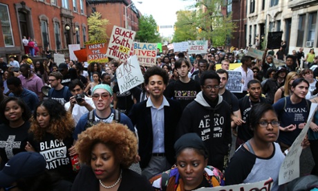 Students from Baltimore colleges and high schools march in protest on their way to City Hall