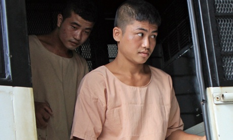 Burmese migrant workers Zaw Lin (l) and Wai Phyo arrive at court in Koh Samui, accused of killing two British tourists.