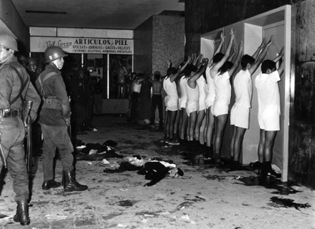 Student protesters are held at gunpoint by soldiers inside an apartment building in Tlatelolco, Mexico City.