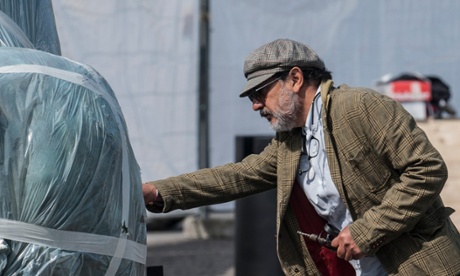 Mexican artist Gustavo Aceves oversees the installation.
