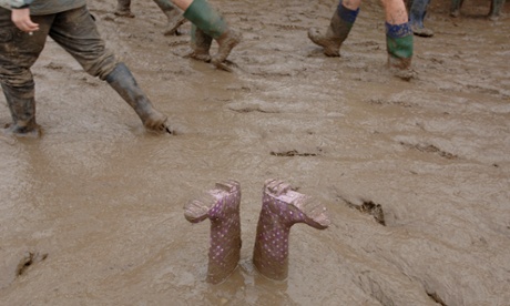 A pair of abandoned wellingtons take in the scene at Glastonbury.