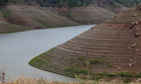 Water lines are visible along the steep banks of Lake McClure on March 24, 2015 in La Grange, California. Starbucks’ Ethos water draws from the Sierra Nevada range, in an area experiencing “exceptional drought.” 