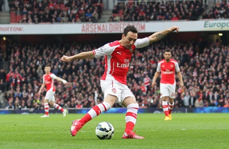 Santi Cazorla fires a shot goal-wards.