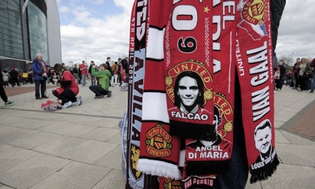 Scarf sellers outside Old Trafford. Not sure how brisk business is.