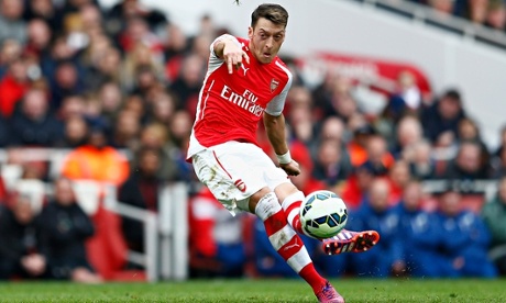 Mesut Özil scores Arsenal's second against Liverpool in the Premier League at the Emirates Stadium