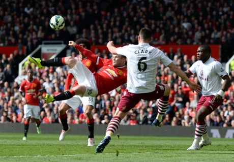 Manchester United's Wayne Rooney goes for an acrobatic bicycle kick shot but it misses the target.