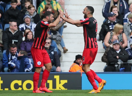 Charlie Austin celebrates with Steven Caulker after scoring the second goal for QPR.