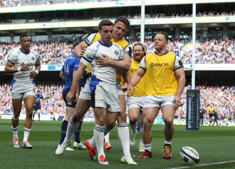 George Ford gets hugged by Sam Burgess as his team-mates congratulate him.