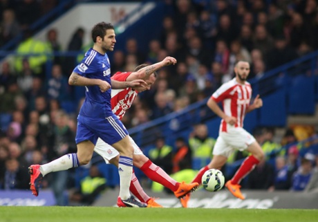 Cesc Fabregas doesn't bother chasing down Charlie Adam as the Stoke man is fourteen yards inside his own half, what's he gonna do from there?