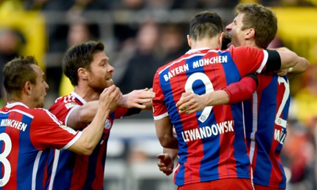 Robert Lewandowski celebrates with his Bayern Munich team-mates after opening the scoring in Dortmund. Not for the first time.