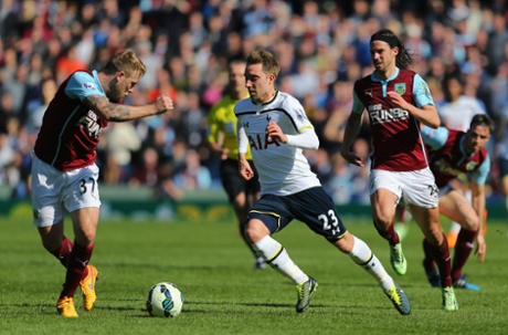 Christian Eriksen looks to go past Scott Arfield.