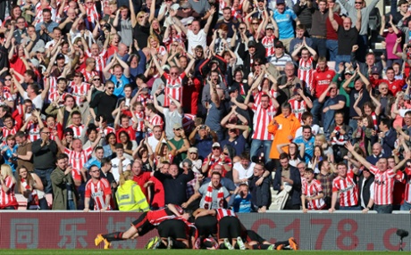 Sunderland players celebrate the opening goal scored by Jermain Defoe.