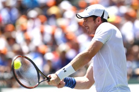 Andy Murray returns.