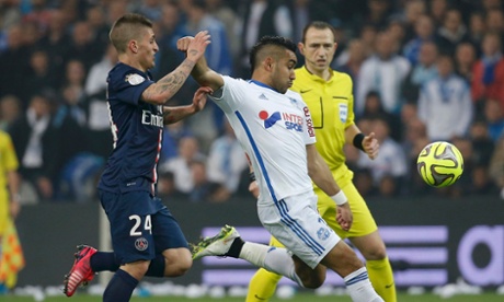Marseille's Dimitri Payet, right, challenges PSG's Marco Verratti during the sides' Ligue 1 match.